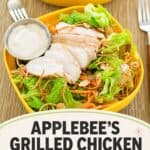 A salad with grilled chicken and Oriental dressing.
