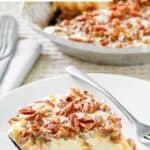 A slice of copycat Baskin Robbins turtle ice cream pie on a plate and the pie behind it.