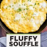 A fluffy souffle-style omelet in a skillet.