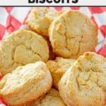 Copycat KFC buttermilk biscuits piled on parchment paper.