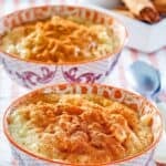 Copycat Kozy Shack rice pudding with cinnamon on top in two bowls.