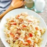 Copycat Luby's skillet cabbage with bacon and tomato on a platter.