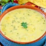 Copycat Monterey's Little Mexico chile con queso dip served with tortilla chips.