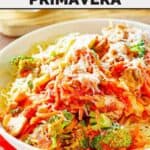 Copycat Olive Garden capellini primavera served in a pasta bowl.