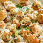 Copycat Olive Garden stuffed mushrooms with clams on parchment paper.