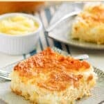 A slice of homemade pineapple angel food cake and a small bowl of pineapple.