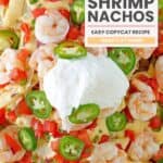 Copycat Red Lobster shrimp nachos with queso, tomatoes, jalapeños, and sour cream.