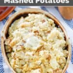 Copycat Saltgrass Steakhouse roasted garlic mashed potatoes in a dish resting on a kitchen towel.