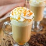Copycat Starbucks caramel macchiato topped with whipped cream and caramel drizzle.