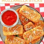 A platter of copycat TGI Friday's fried mozzarella cheese sticks with marinara for dipping.