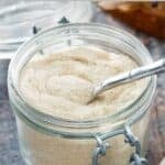 Homemade vanilla sugar in a glass jar.
