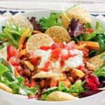 Copycat Wendy's taco salad loaded with toppings.