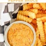 A small cup of copycat Whataburger creamy pepper sauce and crinkle-cut fries.